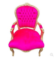 a pink velvet chair with gold trimmings on the back and arms, sitting in front of a white background