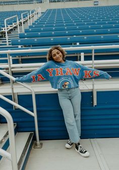 Make your way to the big game in this Kansas JayhawksWomens Blue Phipps Split Sleeve Crop Crew Sweatshirt! This Jayhawks Long Sleeve Sweatshirt features a screen print team name and logo seal. Stay warm and comfortable with this Womens KU Jayhawks Jayhawks Crew Sweatshirt. Cheap Game Day Sweatshirt With Team Name, Blue Varsity Tops For Game Day, Blue Sports Fan Tops For College, Blue Tops For Fall Game Day, Blue Collegiate Sweatshirt For Campus, Blue Varsity Style Tops, Blue Crew Neck Top For Campus, Blue Varsity Tops For Campus, Blue Varsity Top For Campus Wear