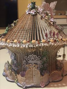 an elaborately decorated carousel sits on a table