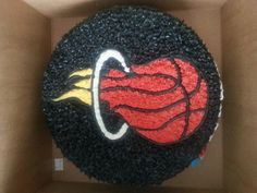 a birthday cake in the shape of a basketball ball