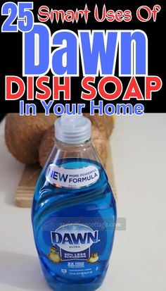 a bottle of dawn dish soap sitting on top of a counter next to a teddy bear