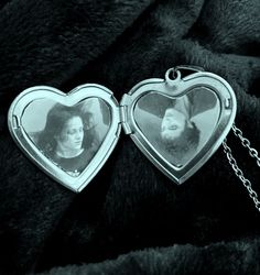 two heart shaped lockes with a man and woman in them