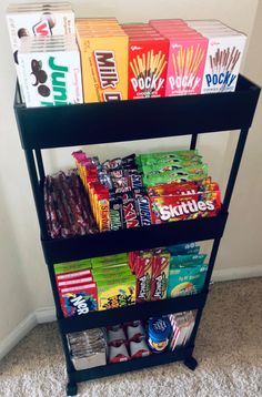 a shelf filled with snacks on top of carpeted floor