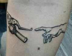 a tattoo on the arm of a person holding a lighter