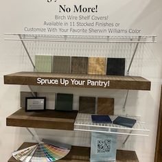 a display case with various colors of paint and samples on it for sale at a home decor store