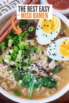 a bowl of ramen with an egg on top and chopsticks next to it