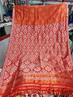 Experience the luxurious elegance of Assam silk with our handcrafted mekhela chadors. Each piece is carefully crafted using only the finest silk from the Assam region in India, known for its softness and durability. The intricate designs and traditional motifs make these mekhela chadors perfect for any special occasion, or simply as a statement piece in your wardrobe. Perfect for a modern women who want to keep her traditional roots alive. Each chador is unique and made with love, so you can be Unstitched Self Design Orange Lehenga, Semi-stitched Orange Blouse Piece With Self Design, Orange Lehenga With Motifs For Navratri, Semi-stitched Orange Self Design Blouse Piece, Orange Semi-stitched Self Design Blouse Piece, Orange Self Design Blouse Piece For Diwali, Semi-stitched Self Design Orange Blouse Piece, Orange Saree Blouse Piece For Festivals, Unstitched Orange Self-design Lehenga