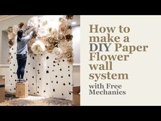 a man working on paper flowers in a room with the words how to make a diy paper wall system