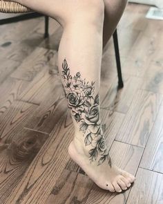 a woman's foot with flowers on it