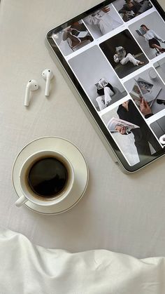 an ipad and cup of coffee on a table