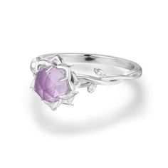 Illuminate your journey with the Moonflower Amethyst Ring. Nestled in a blooming setting, a rose-cut round amethyst takes center stage, embraced by a twisted band adorned with sparkling white topaz gems. But here's the enchanting secret – a hidden moon beneath the gemstone, a reminder that even in the darkest nights, there's always a shimmering source of light. Let this ring be your daily inspiration to embrace the beauty of growth and blooming possibilities, for within you, there's a hidden moo Amethyst Promise Ring With Rose Cut Diamonds, Round Amethyst Promise Ring With Rose Cut Diamonds, Purple Amethyst Jewelry With Rose Cut Diamonds, Amethyst Ring With Rose Cut Diamonds, Round Amethyst Ring With Rose Cut Diamonds, Amethyst Ring With Rose Cut Diamonds As A Gift, Elegant Purple Gemstone Flower Ring, Amethyst Crystal Promise Ring, Round Shape, Amethyst Crystal Promise Ring