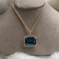 JP0059-LBT 'Gossip' London Blue Topaz Emerald Cut Pendant in 18K Yellow Gold with Diamonds 30'' Chain included. Stone Size: 24 x 18 mm Approx. gemstone Wt: 42.13 Carats (London Blue Topaz) Diamonds: G-H / VS, Approx Wt: 0.53 Cts Luxury Aquamarine Necklace For Formal Occasions, Luxury Blue Topaz Gemstone Necklace, Luxury Aquamarine Gemstone Necklaces, Luxury Aquamarine Gemstone Necklace, Luxury Blue Topaz Necklace For Anniversary, Luxury Blue Topaz Necklaces For Anniversary, Luxury Topaz Necklace With Gemstone Accents, Luxury Aquamarine Pendant Necklace, Luxury Aquamarine Necklace For Anniversary