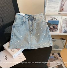 Dare to be bold and stylish with our rivet embellished layered denim skort from the 2023 Summer Collection! Lovingly crafted for the modern fashionista. this skort promises to make a lasting impression with its intricate patchwork. mid-waist fit. and zipper & button closure. Why You'll Fall In Love Rivet Embellished: Make a statement with this skort. adorned with intricate rivet details for a touch of chic sophistication. Layered Denim: Its layered denim material ensures comfort and breathability. allowing you to move freely and flaunt your style with ease. Patchwork Perfection: Each layer of denim is expertly adorned with an intricate patchwork design. adding a delightful touch of visual allure. Mid-waist Fit: Its mid-waist fit accentuates your figure. creating the perfect balance between Trendy Non-stretch Short Skirt, Trendy Non-stretch Short Length Skirt, Trendy Pleated Skirt For Spring, Chic Denim Mini Skirt For Summer, Trendy Non-stretch Mid-rise Mini Skirt, Trendy Summer Pencil Skirt, Trendy Summer Mini Skirt, Trendy Spring Mini Skirt, Chic Summer Denim Skirt