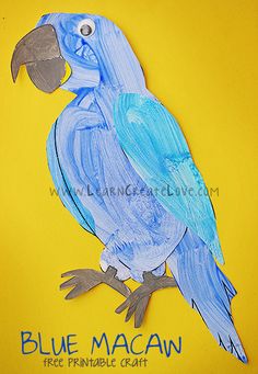 a blue macaw painted on yellow paper with the words blue macaw below it