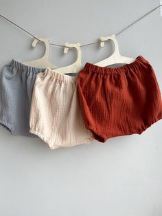 Introducing our adorable baby bloomers, designed to keep your little one comfortable and stylish during the all seasons.   Choose color from drop menu! Crafted with care, the diaper cover is made from high-quality organic cotton muslin, ensuring a soft and gentle touch against your baby's delicate skin. The breathable fabric provides excellent airflow, keeping your little princess cool and cozy on warm days. Versatile and practical, this baby shorts are available in sizes ranging from newborn to 2 years, ensuring the perfect fit as your little one grows. With twelve vibrant colors to choose from, you can select the ideal shade that suits your baby's personality or matches her existing wardrobe. Whether you're dressing up your little angel for a special occasion or simply enjoying a day out Cotton Bloomers With Elastic Waistband For Playwear, Beach Bloomers With Ruffles In Cotton, White Cotton Diaper Cover With Elastic Waistband, Cute Cotton Bloomers For Beach, Ruffled Bottoms For Summer Playtime, Cotton Bottoms With Ruffles For Playtime, Spring Beach Bloomers In Cotton, Spring Beach Cotton Bloomers, Cotton Diaper Cover With Elastic Waistband For Playtime