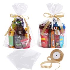 two bags filled with different types of beer and other items next to a ribbon on a white background