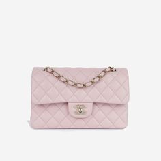 Sleek, refined and effortlessly chic, the Classic Small Flap Bag embodies Chanel’s non-traditionally feminine aesthetic. Crafted from a light pink lambskin leather and complimented by champagne-gold hardware, there is nothing more beautiful than this. SPL Exterior Light pink lambskin leather Champagne gold-tone hardware CC turn-lock closure Interwoven chain strap Rear slip pocket Plaque series Immaculate condition - no hardware sticker on CC Interior Matching leather interior Double flap Spacious compartment One slip pocket Chanel embossed leather logo Immaculate condition Comes with box and dust bag SPL Height 15cm Width 24cm Depth 7cm Chanel Crossbody, Mode Chanel, Classic Flap Bag, Gold Chanel, Pink Chanel, Chanel Caviar, Chanel Vintage, Pink Mini, Gucci Handbags