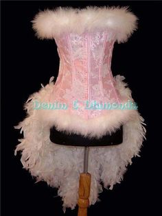 a pink corset with white feathers on it