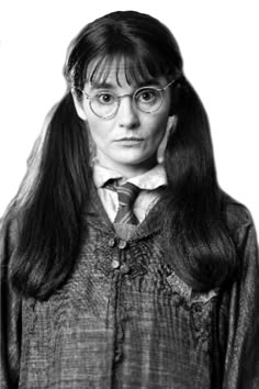 a woman with long hair wearing glasses and a harry potter outfit is looking at the camera