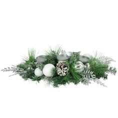 a christmas arrangement with pine cones, ornaments and greenery on a white background photo