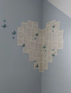 there are many butterflies on the wall in this room, and they look like they have been made out of newspaper