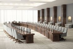 an empty conference room with long tables and chairs