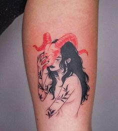 a woman with a snake tattoo on her arm is holding a red rose in her right hand