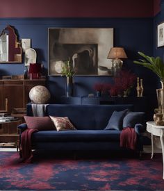 a living room with blue walls and red carpeted flooring, furniture and artwork on the wall