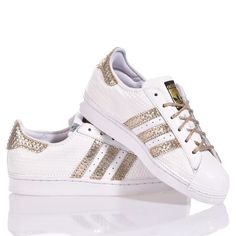 Adidas Superstar White Hive is the super glamorous custom women's sneaker. Entirely in white eco-leather with a geometric texture, featuring the iconic adidas stripes and a textured gold laminated back paired with round gold lurex laces. Adidas Superstar White Hive will also be provided with its original laces. Sporty Gold Sneakers With Perforations, Gold Sneakers With Perforations, Gold Sneakers With Foil Embossed Logo And Round Toe, White Leather Sneakers With Foil Embossed Logo, Gold Low-top Sneakers With Perforations, Geometric Texture, Zegna Shoes, Sneaker Wedge, Luxury Shop