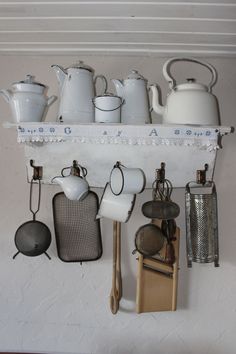 pots and pans are hanging on the wall