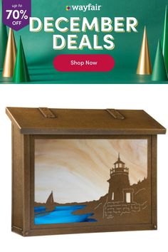 a wooden box with an image of a lighthouse on it and the words wayfair december