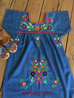 "Beautiful! Hand embroidered Denim Dresses ! Huaraches not included. Sold separately. Each dress is one of a kind embroidery. Size : SMALL ( 6 US ) Fabric: soft denim - fresh - great quality. Care : hand wash or dry cleaning. NO WASHING MACHINE. MEASUREMENTS: Length: 34\" Armpit to armpit: 19\" Dresses are ready to ship." Embroidered Bohemian Denim Dress, Bohemian Embroidered Denim Dress, Blue Embroidered Bohemian Denim Dress, Spring Embroidered Dress With Multicolor Machine Embroidery, Blue Bohemian Embroidered Denim Dress, Embroidered Denim Dress In Blue, Embroidered Blue Denim Dress, Spring Cotton Embroidered Dress With Machine Embroidery, Cotton Embroidered Dress With Machine Embroidery For Spring