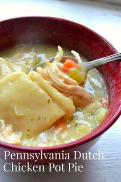 a red bowl filled with chicken pot pie soup