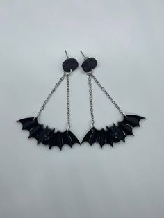 Handmade resin bat dangle earrings with post back findings. Solid black bat resin earrings attached by two chains to a solid black circle stud. Perfect for Halloween or for whenever you're just in a creepy mood. Each pair of earrings are handmade, so no two will look identical. Color may vary slightly from photographs. ALL PAIRS OF EARRINGS ARE MADE TO ORDER. PLEASE ALLOW FOR 5-7 DAY PROCESSING FOR EARRINGS TO BE MADE Bat Cute, Halloween Resin, Flying Bat, Bat Earrings, Earrings Halloween, Black Circle, Cute Pens, Bat Wing, Black Bat