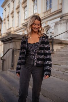 Black and silvery striped long sleeve cardigan that has glitter in the fabric and will have you glistening all day and night long! This cardigan is perfect way to 'spice' up your typical wardrobe collection for Fall and Winter! Our model wears the Grey Baptiste Jeans and the Black Glittery Vincent Top ONE SIZE (fits from US 2-4-6-8) Length 19.29 in - Width 21.65 in Contextures: 40% acrylic - 30% polyamide - 25% polyester - 5% wool Washing: handwash Glamorous Winter Cardigan For Night Out, Glamorous Evening Cardigan For Winter, Glamorous Evening Winter Cardigan, Glamorous Winter Sweater For Night Out, Glamorous Sequin Winter Cardigan, Sequin Winter Cardigan For Night Out, Clothes Europe, Women's Fall Fashion, Parisian Women