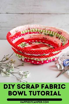 some fabric bowls are sitting on a table with scissors and flowers in front of them