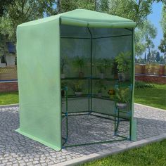 This spacious greenhouse can accommodate a considerable number of fruits, vegetables and plants. This plant house will be a great solution for protecting your plants against wind, rain, sunshine and bird damage. The greenhouse is made of 0.6 oz/ft² PE mesh fabric, which is 25% heavier than the standard mesh fabric of many competitors. This plant house has a sturdy and rust-proof powder-coated steel frame for extra stability. This greenhouse is equipped with shelves to well arrange and display plants; and a door for great ventilation and easy access. The greenhouse is easy to assemble. Please note the roof of our greenhouse cannot withstand heavy snowfall. Warning: The greenhouse is not a construction building or conservatory, intended for leisure purposes Color: Green Material: PE (polyeth Buy Greenhouse, Mini Serre, Home Greenhouse, Greenhouse Plants, Cold Frame, Love Your Home, Garden Structures, Fruits Vegetables, Lawn Care