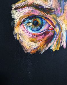 an eye is painted with colored pencils on black paper