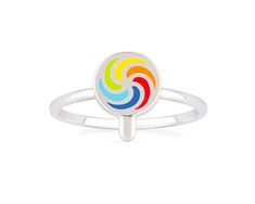 a white ring with colorful swirls on the front and center, sitting on a white surface