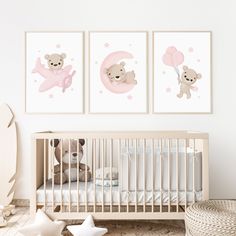 a baby's nursery room with three pictures on the wall