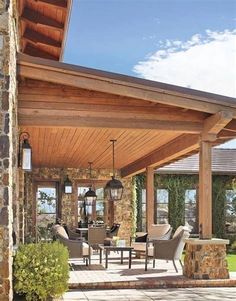 a covered patio with chairs and tables