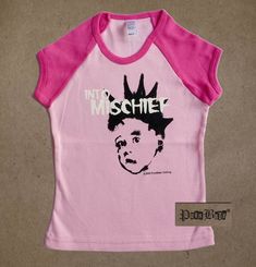 Into Mischief pink short sleeve tee with neon pink neck and raglan sleeves  -Inspired by The Misfits -Available in 2T or 4T -This style is fitted Our teensy styles are all hand printed on American made goods, in Los Angeles, with original Punk Baby® designs.   Shipping:  2-3 items (depending on size) will cost the same to ship within the US and internationally.  For international shipments, please allow more time to ship and to calculate shipping. Pink Punk T-shirt For Summer, Unisex Pink T-shirt With Screen Print, Unisex Pink T-shirt With Band Merch, Unisex Pink Playful T-shirt, Unisex Pink T-shirt For Spring, Pink T-shirt For Spring, Unisex Pink Screen Print T-shirt, Pink Punk Style Summer T-shirt, Unisex Pink Summer Tops