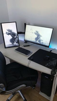 two computer monitors sitting on top of a desk next to a keyboard, mouse and monitor