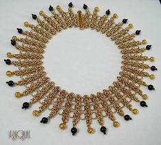 Royal gold and onyx collar necklace by RaquelChelouche on Etsy Elegant Gold Beads Choker Necklace, Elegant Gold Beaded Choker Necklace, Gold Beaded Choker For Parties, Gold Bib Necklace With Chain For Gift, Gold Beads Choker For Party, Elegant Metal Chain Necklace With Gold Beads, Gold Bib Necklace As A Gift, Elegant Chain Necklace With Gold Beads, Gold Bib Necklace With Beads For Party