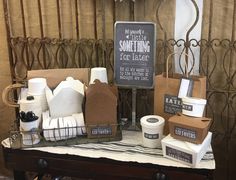 a table topped with lots of different types of paper towels and other items on top of it