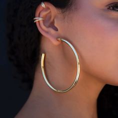 The Large Tube Hoops are a staple in every jewelry collection. Can be worn alone or stacked with an ear party. Provides a bold look without the weight. These earrings are perfect for this summer, you can feel glamorous wearing these weightless statement hoops pool and oceanside since they are sweat and waterproof. Style with our "Double CZ Ear Cuff" for a classic combo. This product is guaranteed for life – GLD will repair or replace the item should you experience any defects in craftsmanship or Tube Hoop Earrings, Cuban Link Necklace, Ear Party, Solid Gold Earrings, Vermeil Jewelry, Custom Earrings, Large Hoop Earrings, Single Earring, Pendant Bracelet