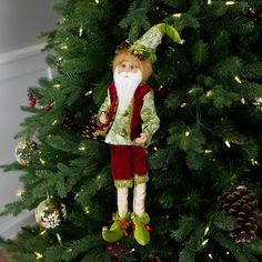 a christmas ornament hanging from the side of a tree