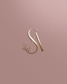 the letter s is made up of gold foil and has a flower on it's side