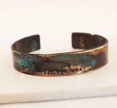 "Our bronze cuff is hand forged from rich jewelers bronze. Cuffs are hammered for texture and then aged in an organic solution to give it a verdigris patina. The aging process creates a different, unique patina on each piece. No two bracelets are exactly alike. A true one of a kind just like you. The Date of your choice is hand stamped into the bracelet. Bronze is the traditional gift for the 8th and 19th anniversary. *SIZING* The circumference of each cuff is the size in inches plus a 1.25\" to 19th Anniversary Gifts, Date Bracelet, Roman Numerals Dates, Roman Numeral Bracelet, 19th Anniversary, 8th Anniversary, Anniversary Gift For Him, Roman Numeral, Anniversary Gifts For Him