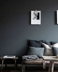 a black and white photo hangs on the wall next to a couch with several pillows